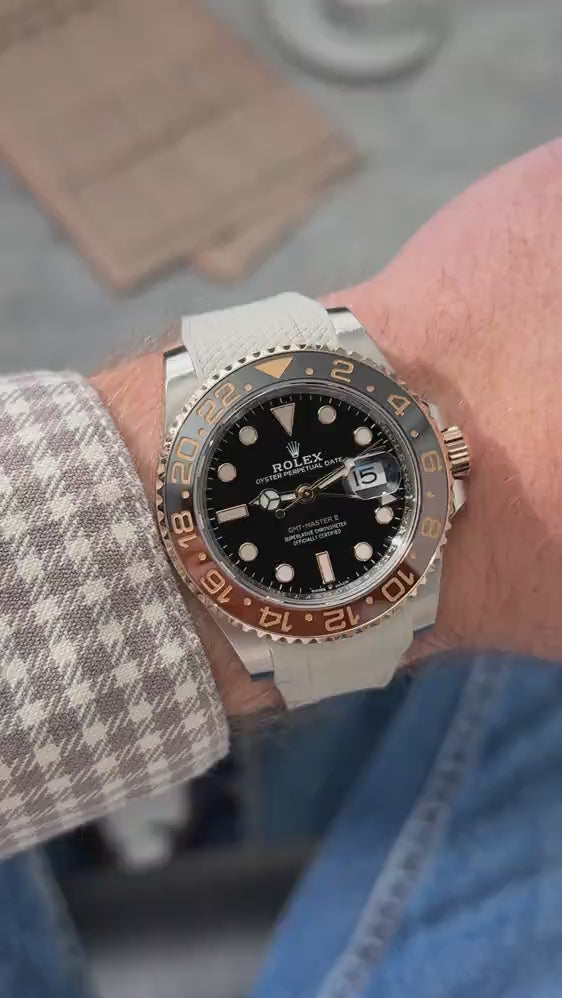 Short UGC clip showing a wrist roll of a  Rolex GMT Master II 126711CHNR with beige vertech rubber strap