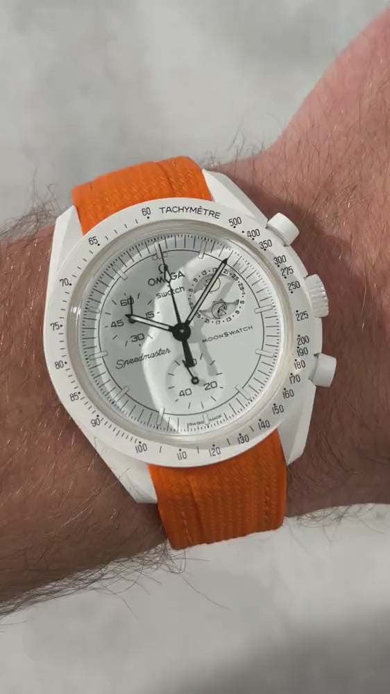 Short UGC clip showing a wrist roll of a MoonSwatch Mission to The Moonphase with a orange rubber strap 
