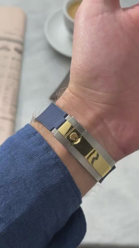 Short UGC clip showing a wrist roll of a  Rolex Submariner 116613 with navy blue vertech rubber strap