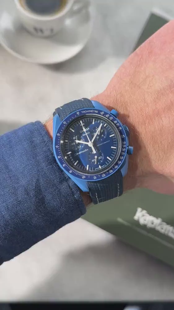 Short UGC clip showing a wrist roll of a MoonSwatch Mission to Neptune with a blue and white rubber strap
