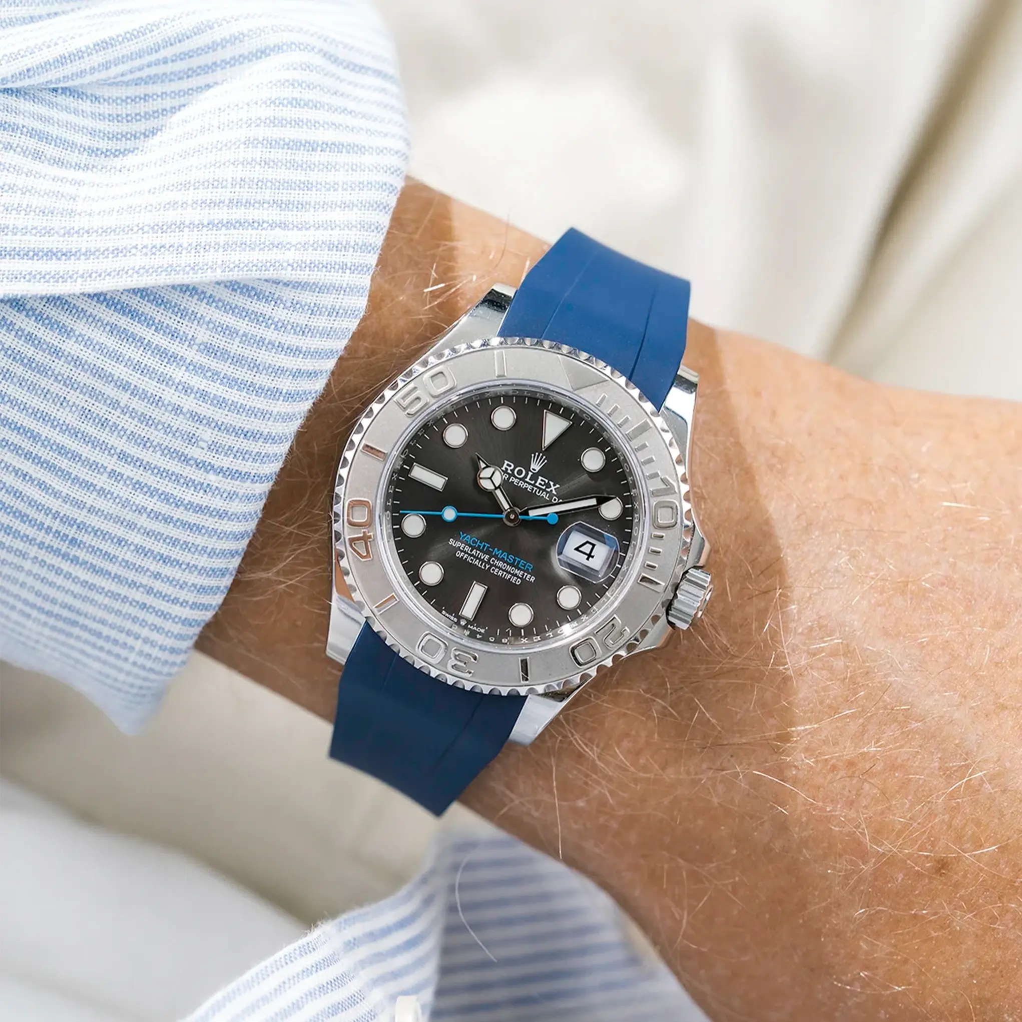 Rolex Yacht-Master fitted with a blue FKM rubber strap from Wristbuddys, close-up wrist view