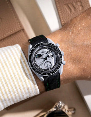 Black curved vertech rubber strap with green stitching for MoonSwatch – wrist shot on Mission to the EarthPhase