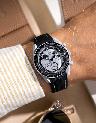 Black curved vertech rubber strap with white stitching for MoonSwatch – wrist shot on Mission to the EarthPhase