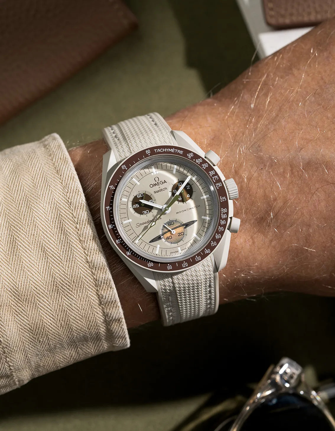 Curved rubber strap for Omega x Swatch MoonSwatch Mission to Saturn – beige strap with a wrist shot