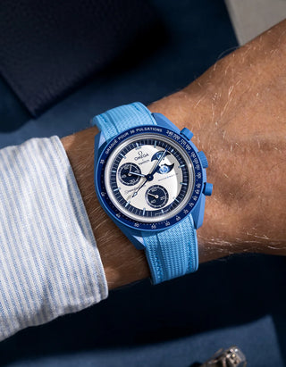 Wrist shot of capri blue rubber strap for MoonSwatch, photographed on the Mission to the Super Blue Moonphase