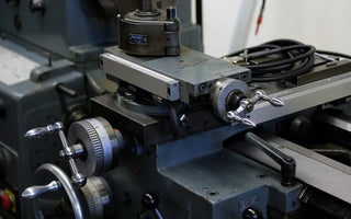 Industrial machine used in the Wristbuddys rubber strap production process for injection molding and heat pressing