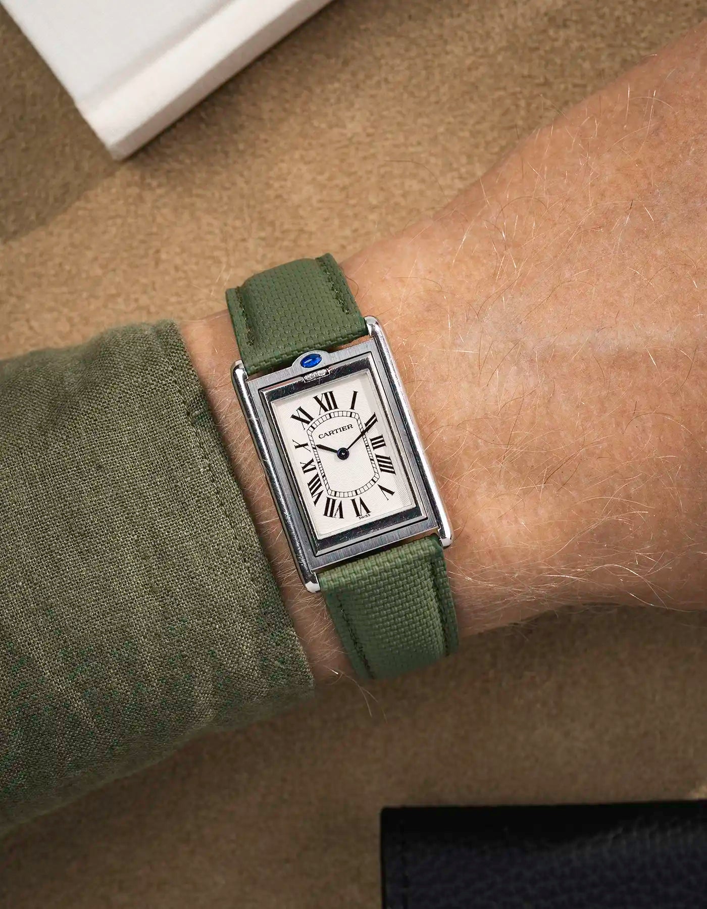 Rubberised sailcloth leather strap worn on Cartier Tank Louis with white dial – straight end and polished case