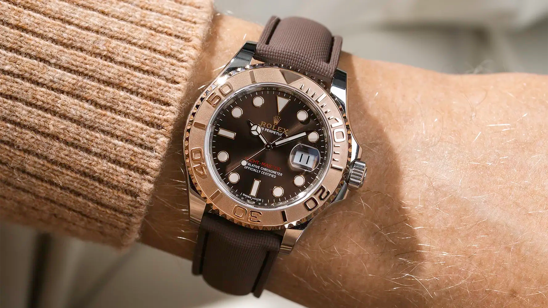 Luxury watch styled with a brown straight end rubber strap from Wristbuddys