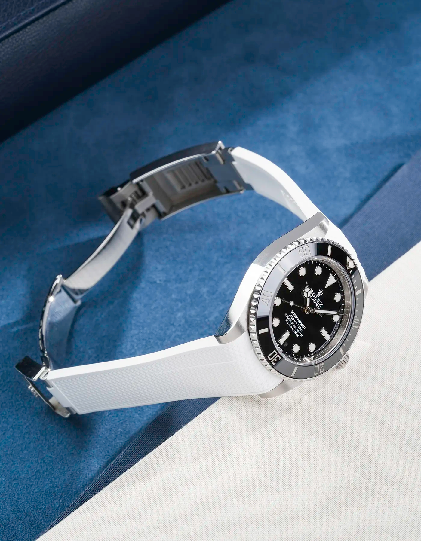 Rolex Submariner 41 with white Vertech FKM Rubber Strap sitting on the watch, integrated with original clasp – product photo side angle with clasp open