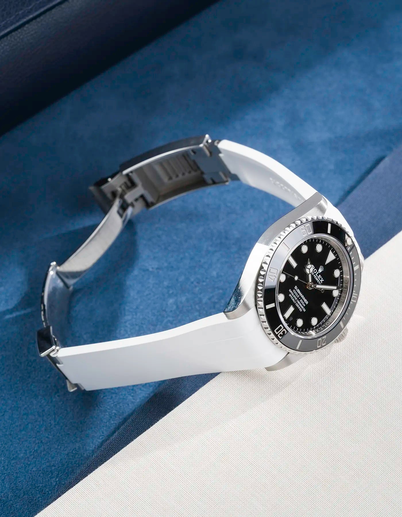 Rolex Submariner 41 with white Classic Smooth FKM Rubber Strap sitting on the watch, integrated with original clasp – product photo side angle with clasp open