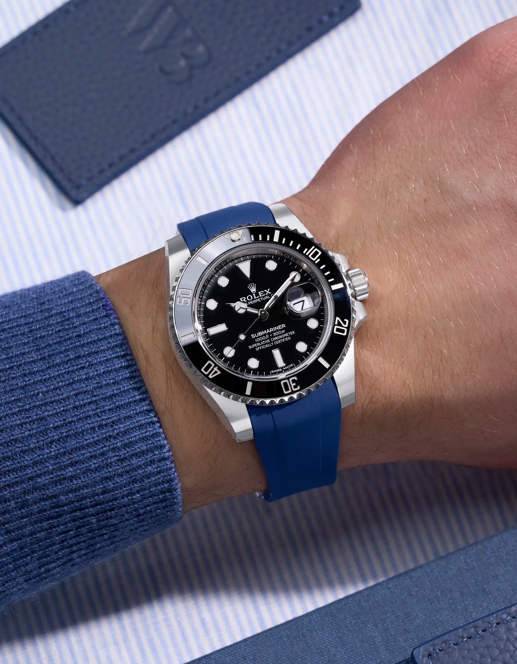Rolex Submariner 116610LN on wrist with blue rubber strap compatible with original Rolex clasp
