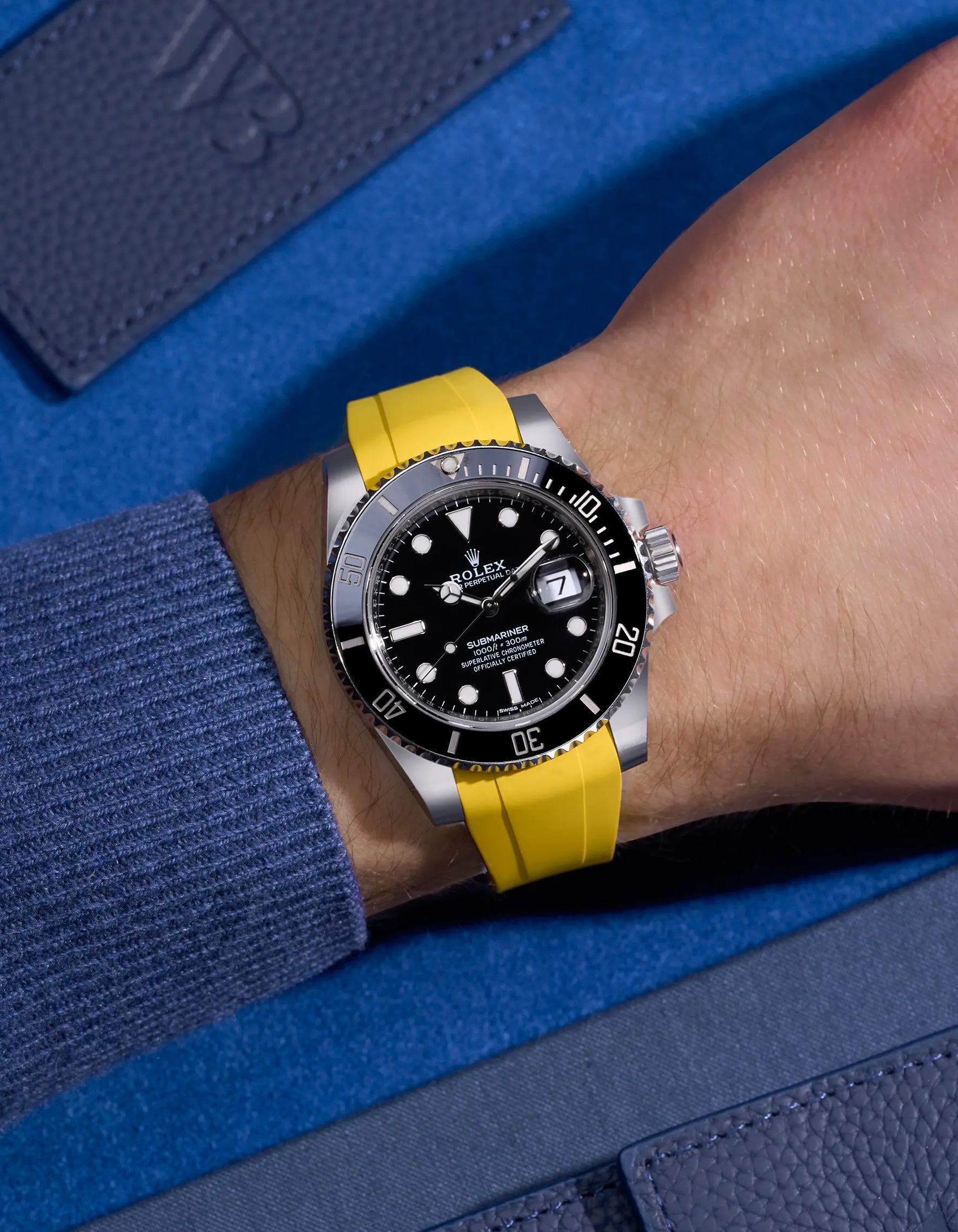 Rolex Submariner 116610LN or 114060LN on wrist with bright yellow rubber strap integrated with original clasp