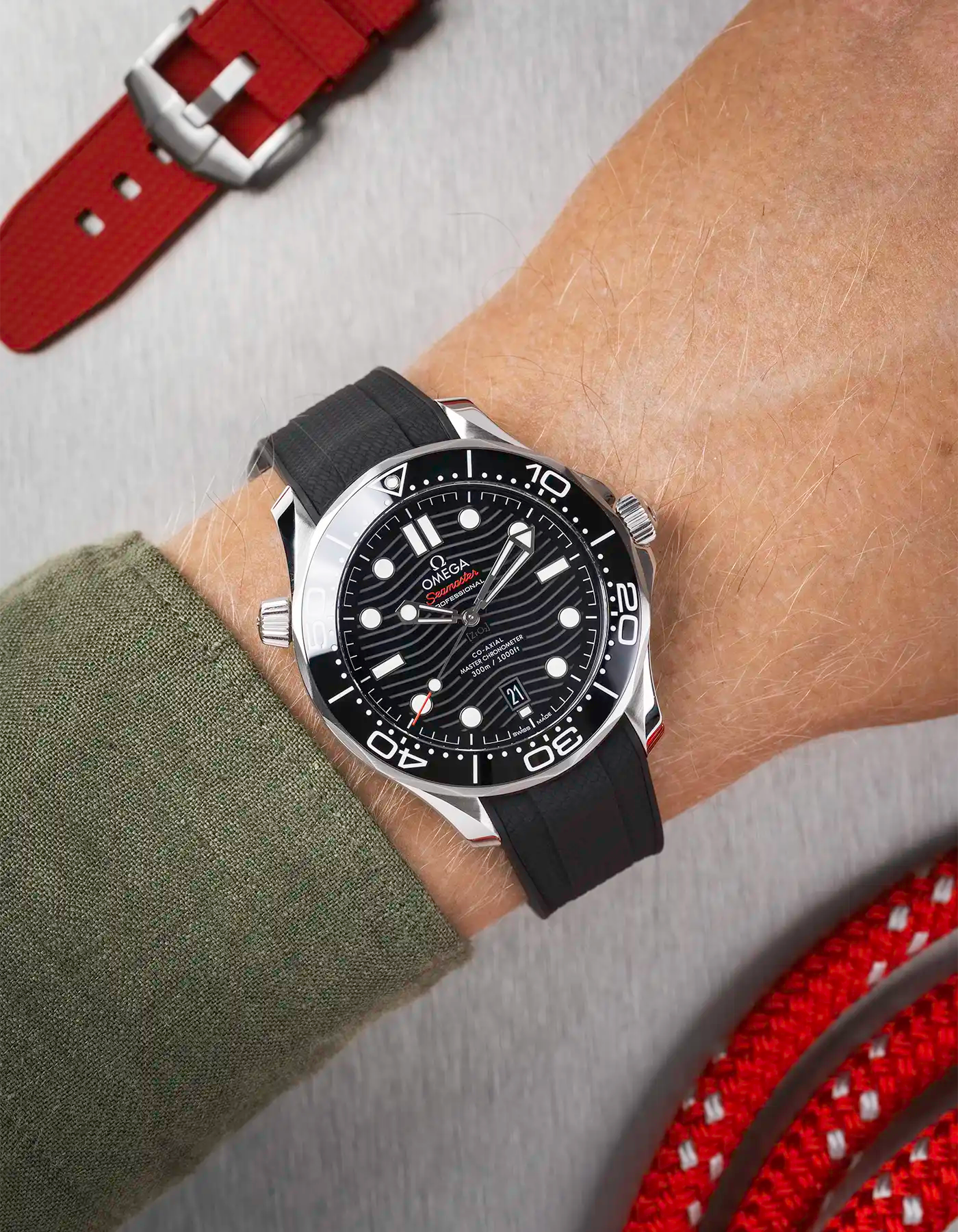 Omega Seamaster 300 Diver with black dial on wrist, paired with black Vertech FKM rubber strap