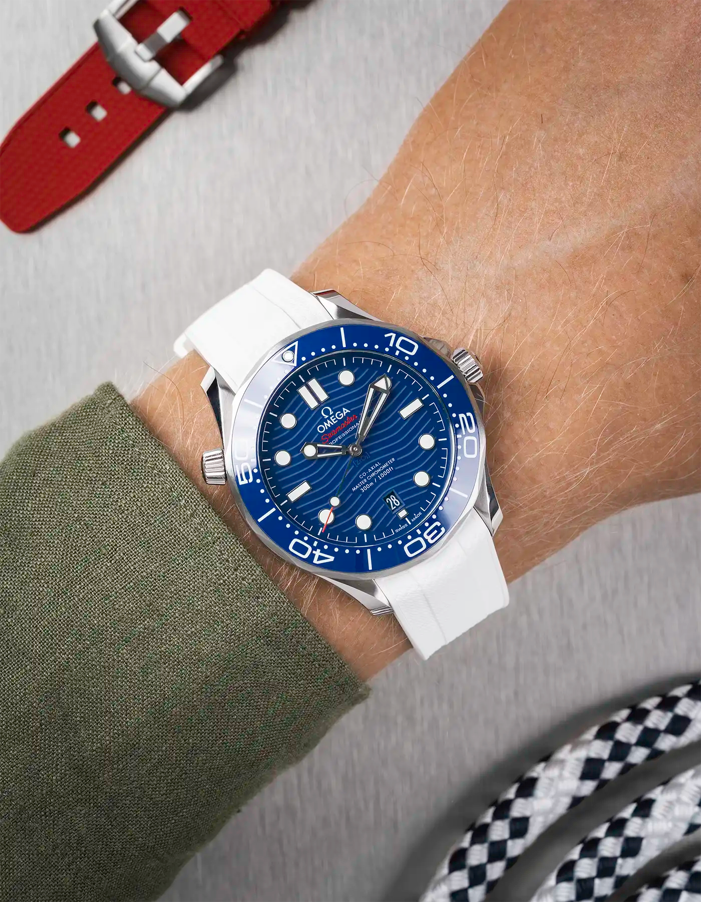 Omega Seamaster 300 Diver with blue dial on wrist, paired with white Vertech FKM rubber strap