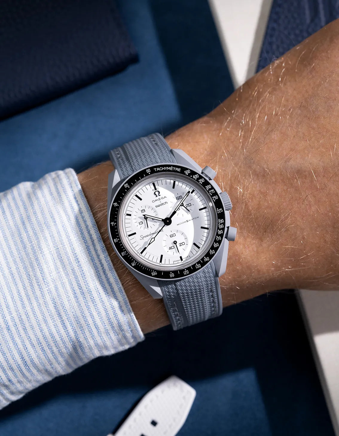 Grey strap designed for Omega MoonSwatch Mission to 1965, wrist shot showing integrated fit and cool tones