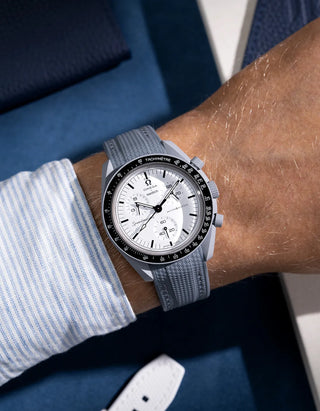 Grey strap designed for Omega MoonSwatch Mission to 1965, wrist shot showing integrated fit and cool tones
