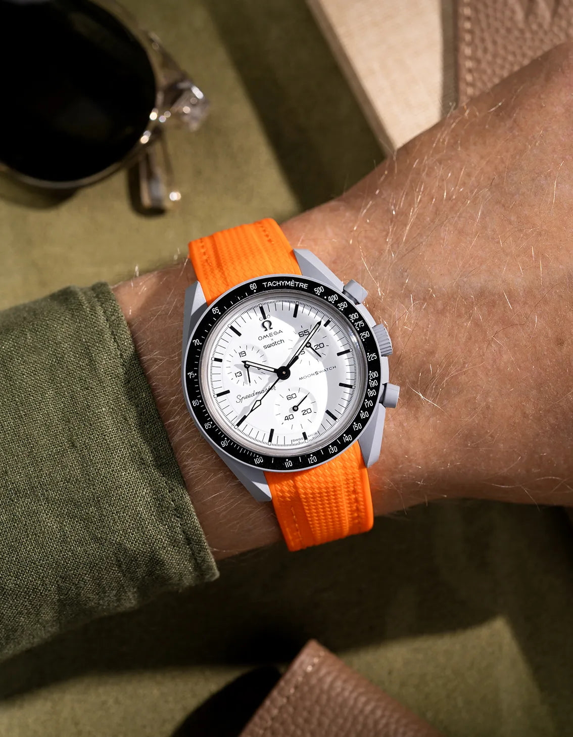 Orange Vertech rubber strap for Omega MoonSwatch Mission to 1965, shown in wrist shot for bold contrast against white dial