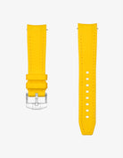 Yellow vertech rubber watch strap with silver clasp on a white background
