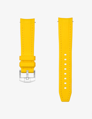 Yellow vertech rubber watch strap with silver clasp on a white background