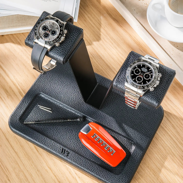 Black leather double watch stand with a Ferrari car key