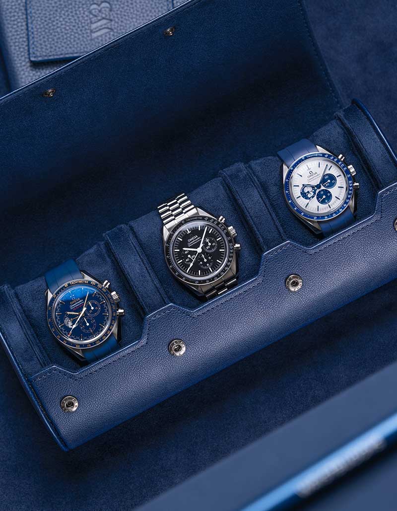 3 Slot Watch Roll in Navy Blue showcasing three luxury watches, highlighting its premium suede interior and secure compartments