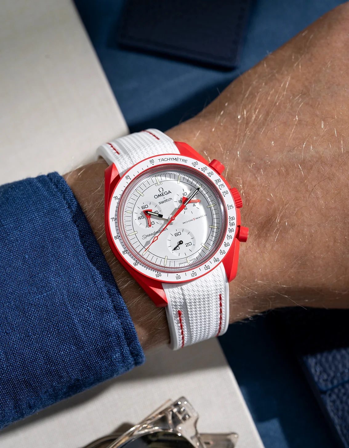 White curved vertech rubber strap with red stitches on MoonSwatch Mission to Mars wrist shot